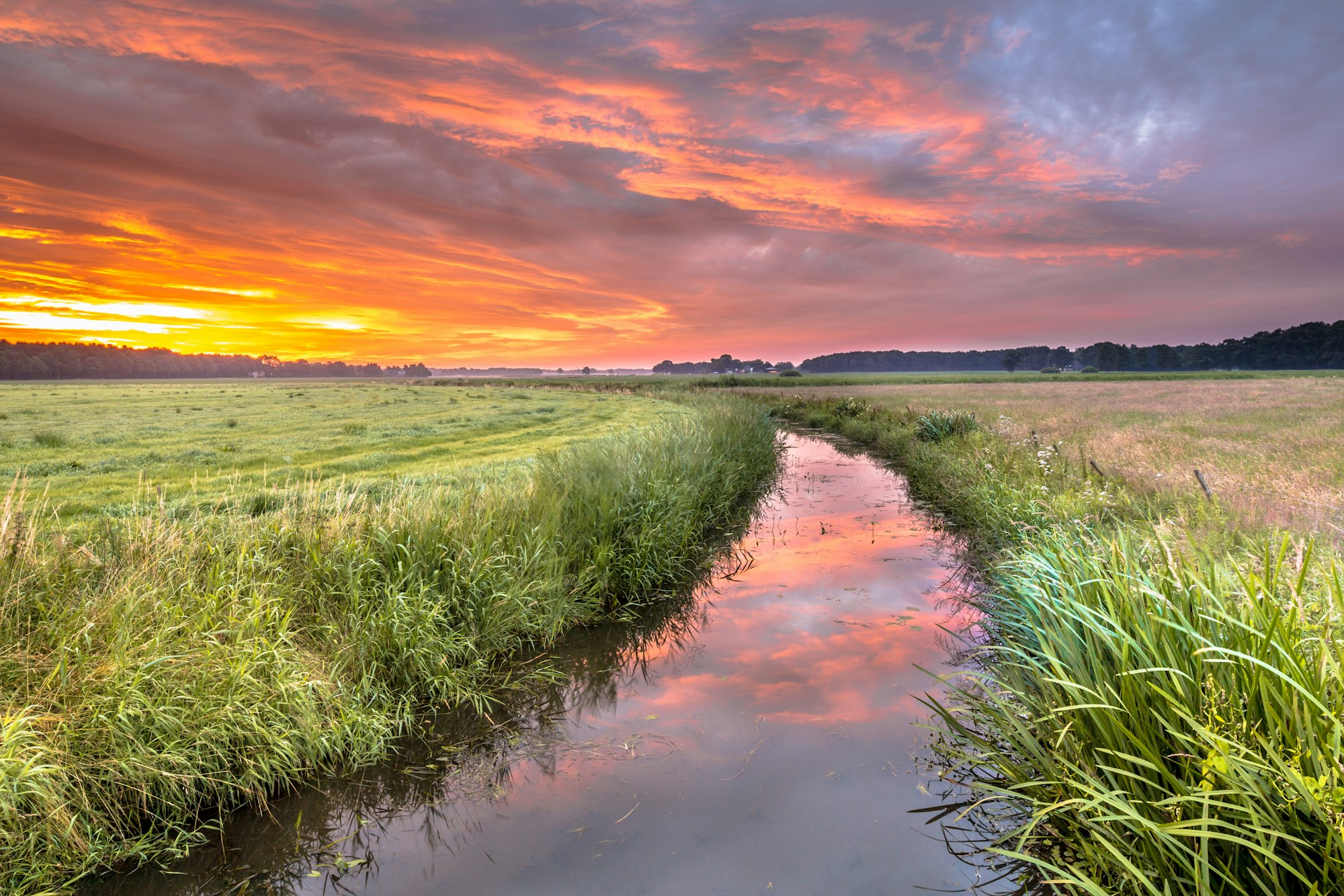 Spiritual voyage concept summer sunrise over lowland river